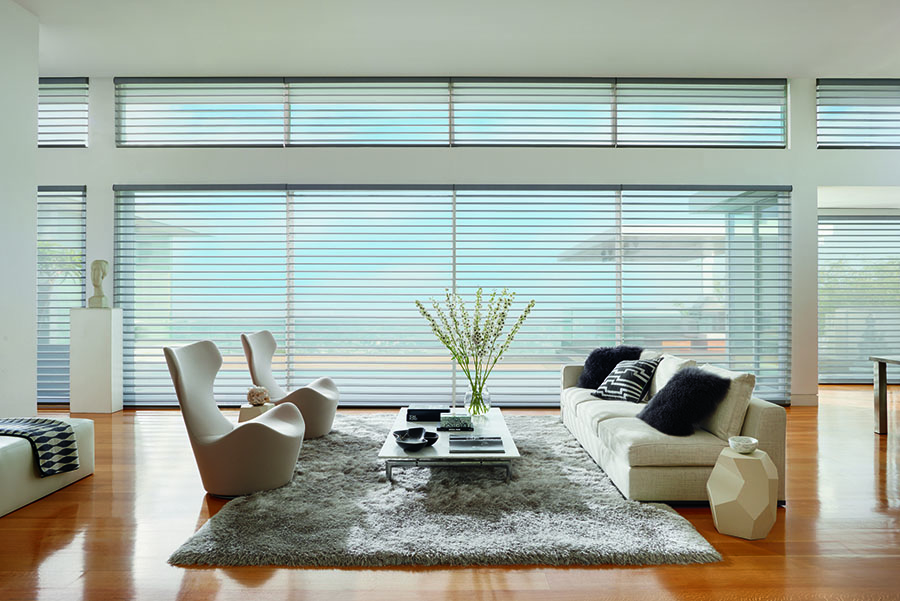 floor to ceiling windows covered with view through sheer shades in Fort Myers FL