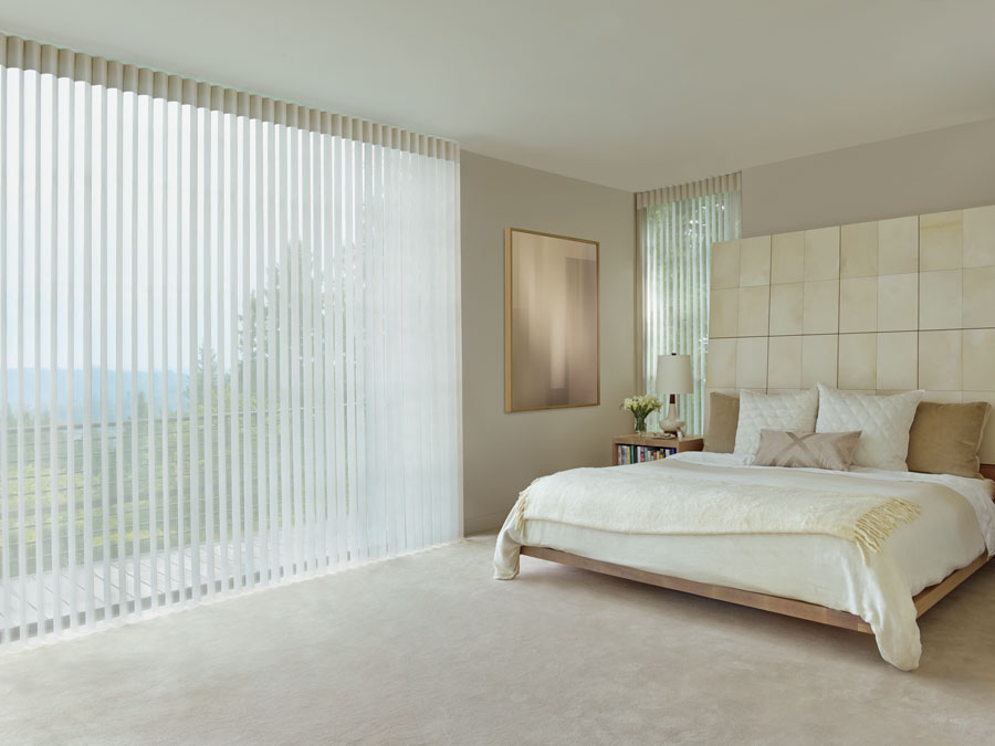 master bedroom wall of windows with privacy sheers covering in Fort Myers FL