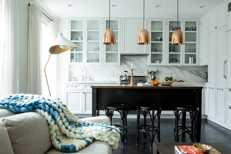 contemporary kitchen with copper island pendants