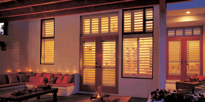 exterior view of fort myers home with hunter douglas shutters interior windows