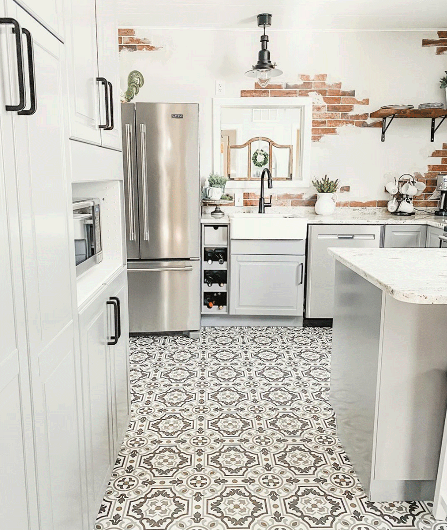 Feature wall of exposed brick in kitchen.