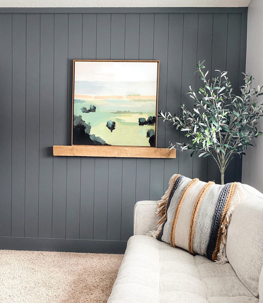 Dark painted vertical shiplap in living room.