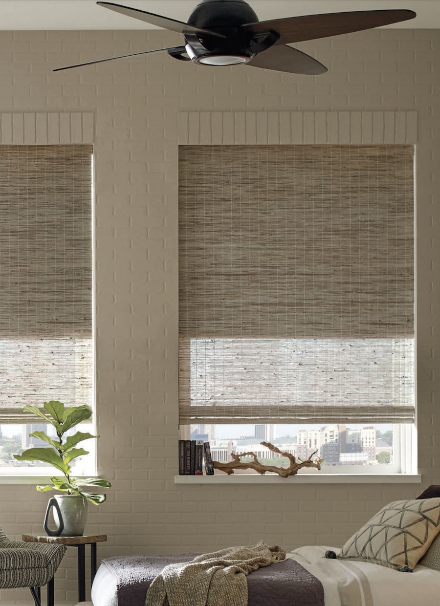 Hunter Douglas Provenance woven woods cellular dual shades in bedroom.