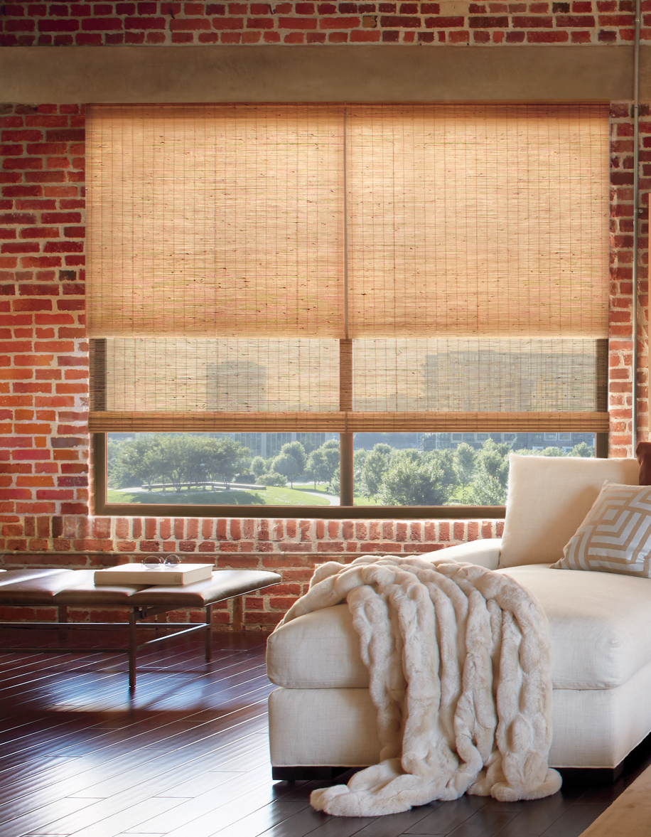 A loft with dual woven shades