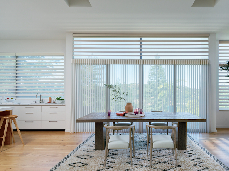 Vertical and horizontal window shades in dining room.