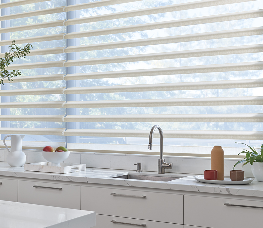 kitchen windows with white pirouette shades in Fort Myers FL