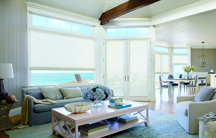 living room whites and blues covering doors