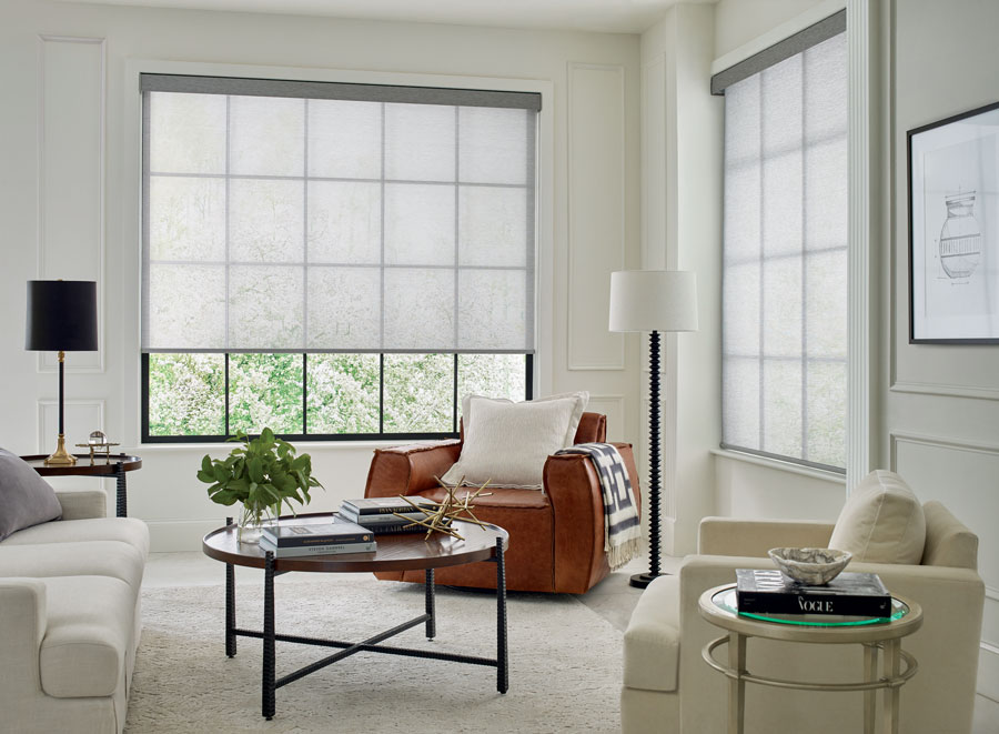 white screen shades provide relief from sun corner living room windows with black frames in Naples Florida