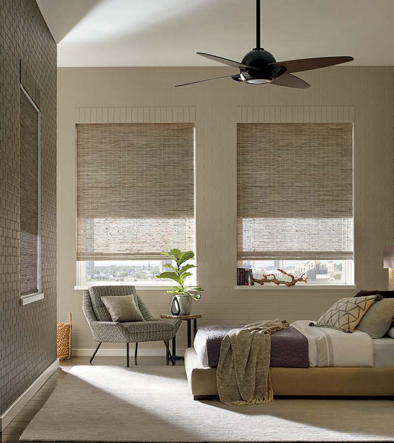 beige bedroom with woven wood shades