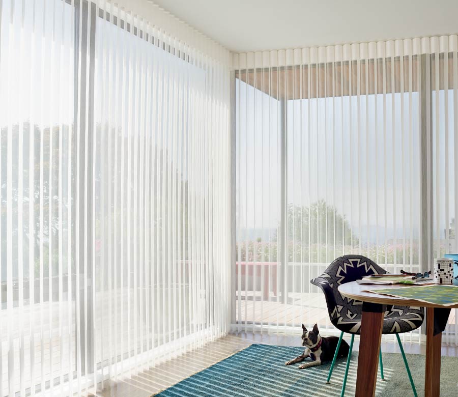 home office with floor to ceiling corner windows and luminette privacy sheer shades