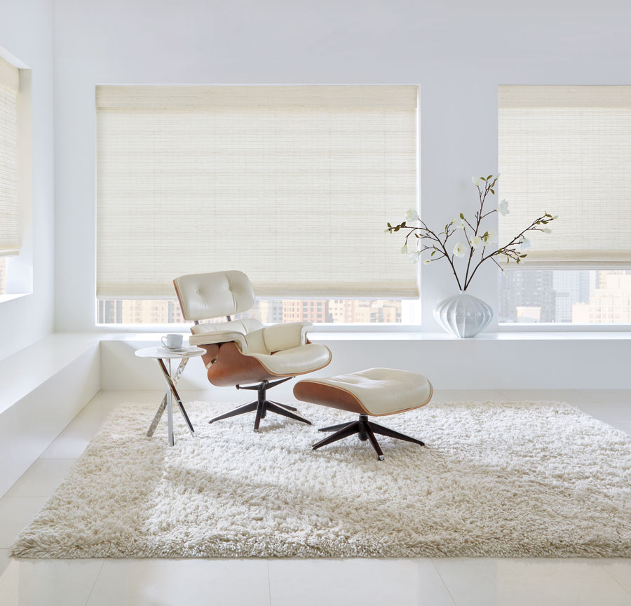 mid century modern eames chair in white living room with undyed white shades