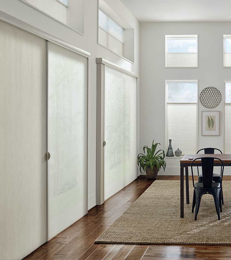 dining room with cream honeycomb shades on sliding glass doors in Fort Myers, FL