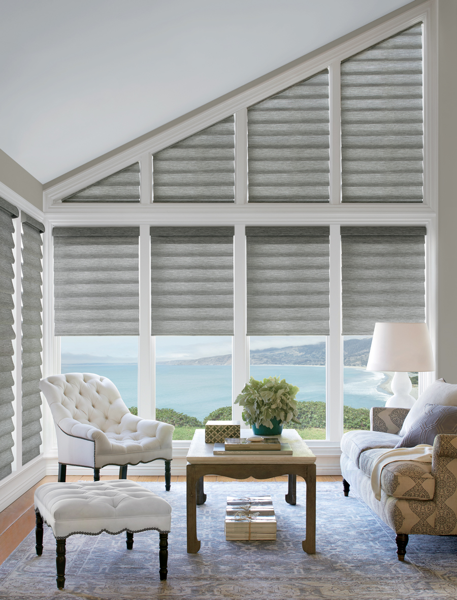 Angled windows featuring roman shades