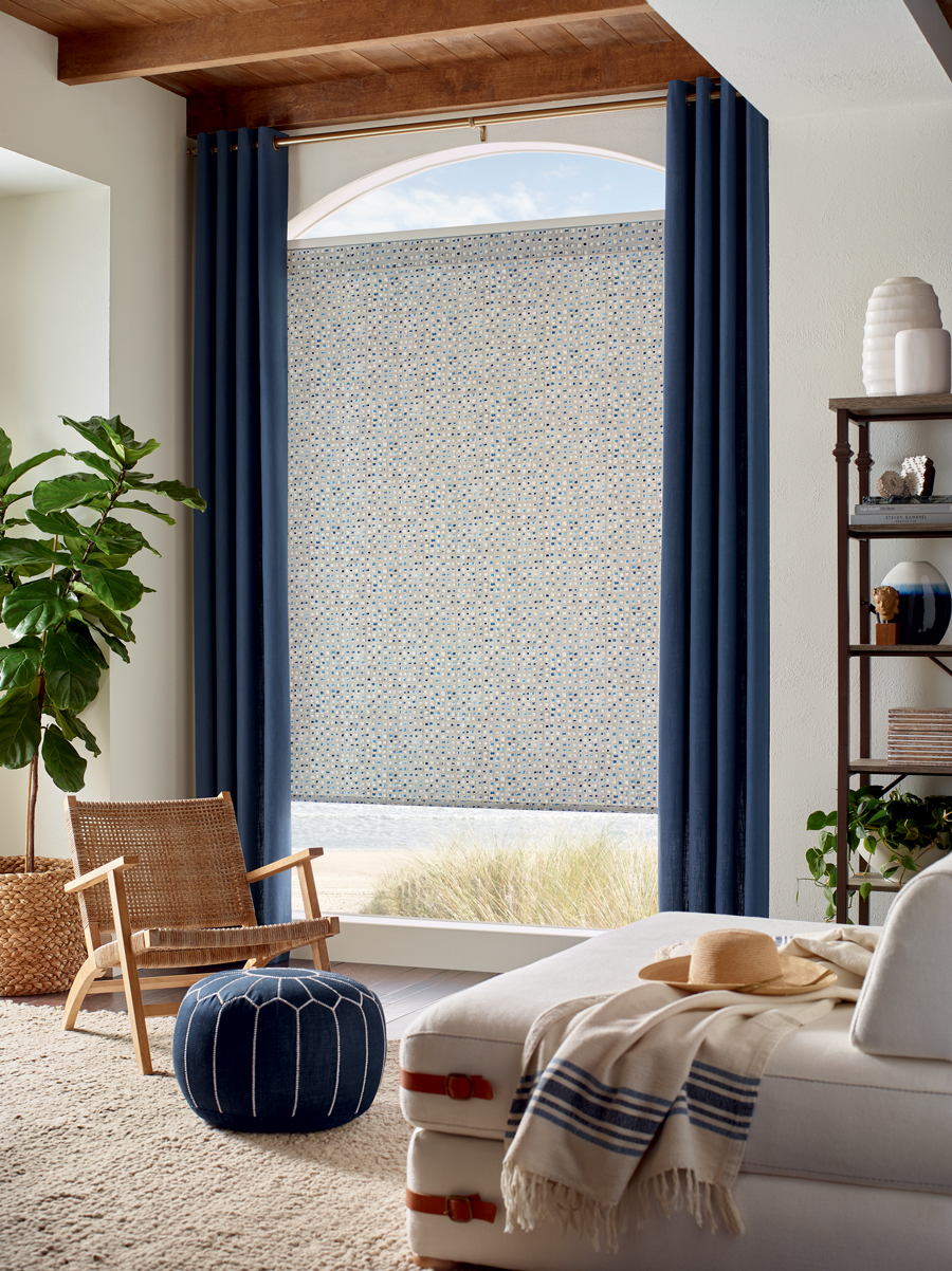 Roller shade paired with drapery panels