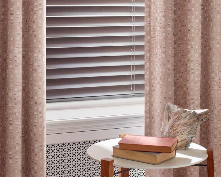 soft blush drapes with square patterns with rose gold aluminum blinds in naples, FL
