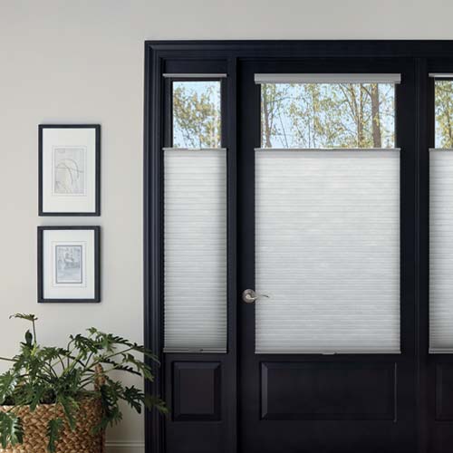 front entryway with shades on narrow windows in black door