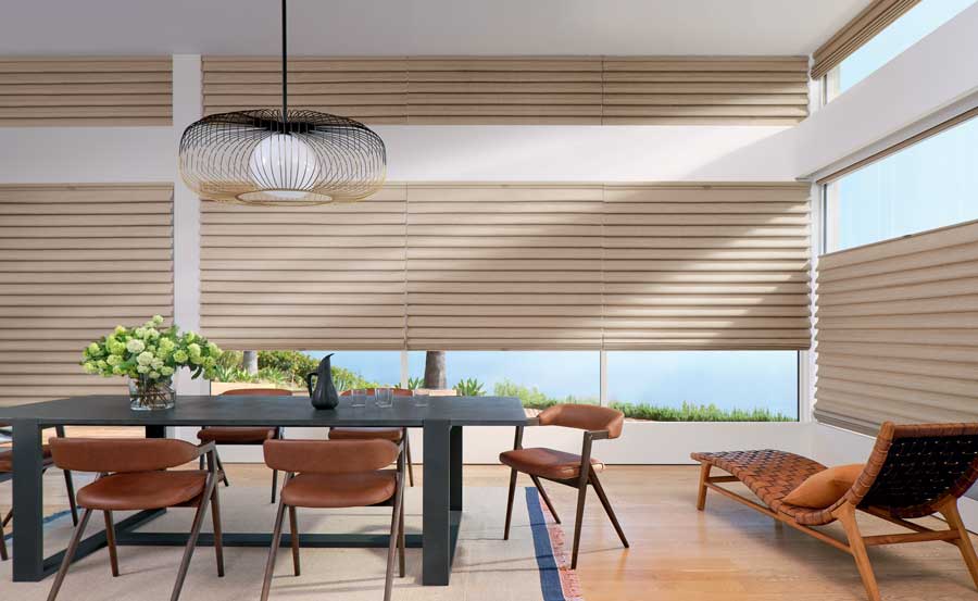 Contemporary dining room with beige Vignette Modern Roman Shades, a black dining table and modern chairs surrounding it.