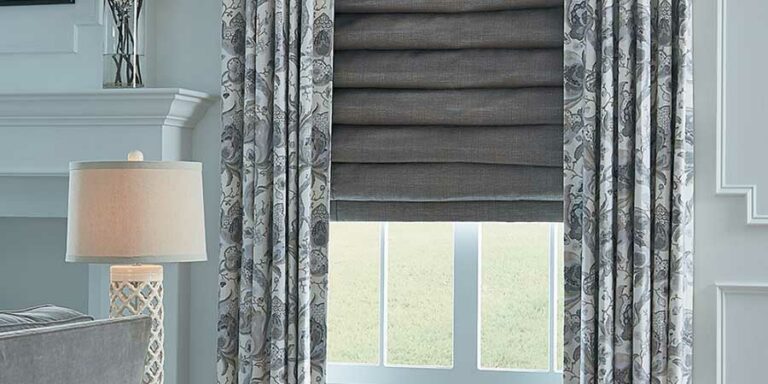 layered fabrics with draperies and roman shades in Fort Myers