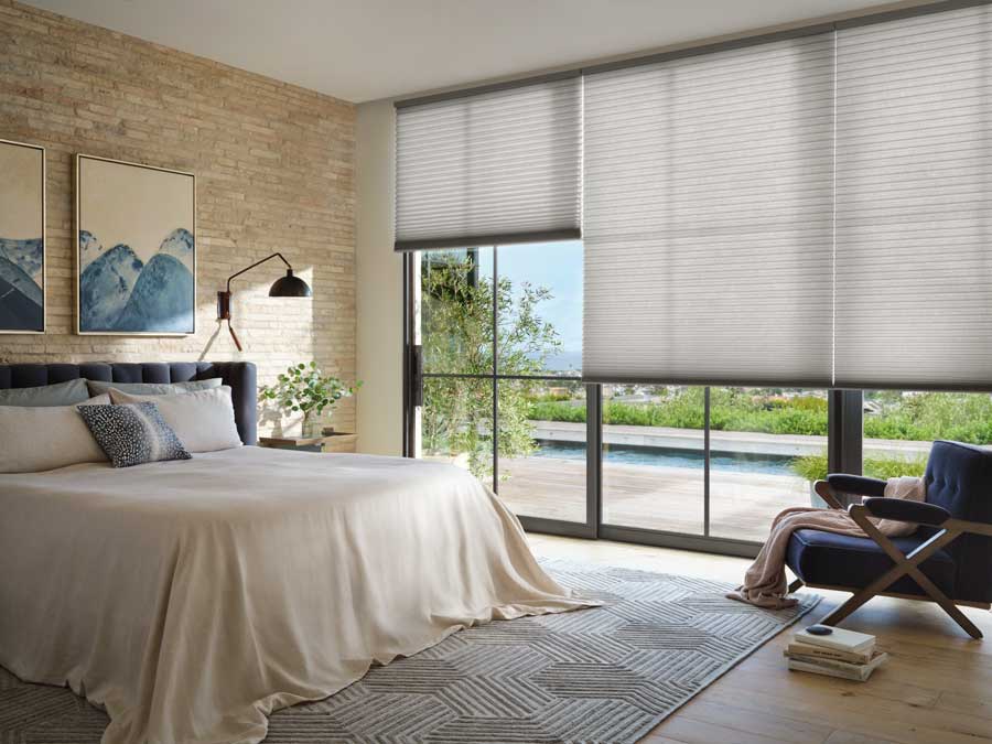 cellular shades on floor to ceiling bedroom windows as energy efficient shades in Fort Myers Florida 