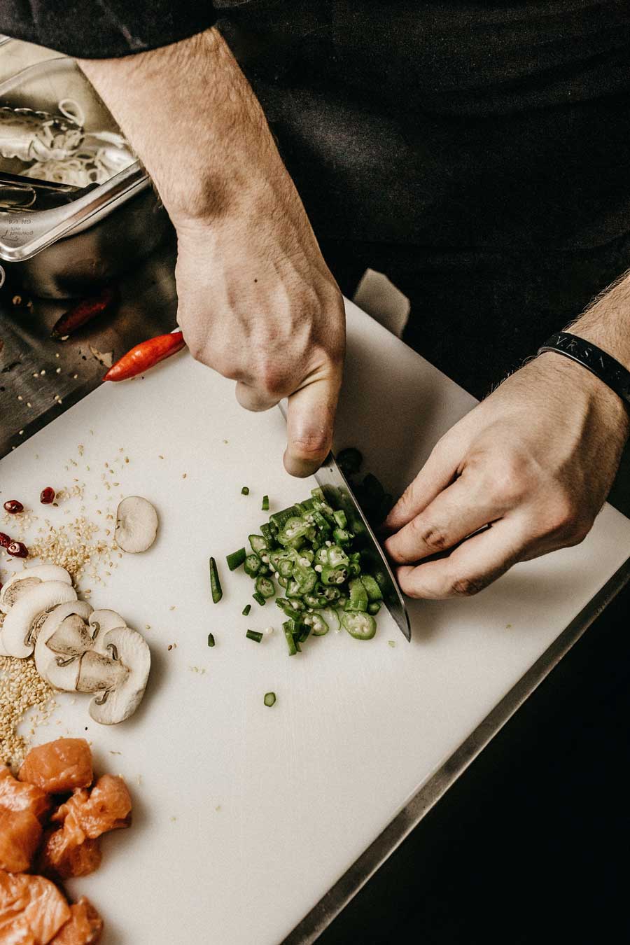 chef at home cuts vegetables