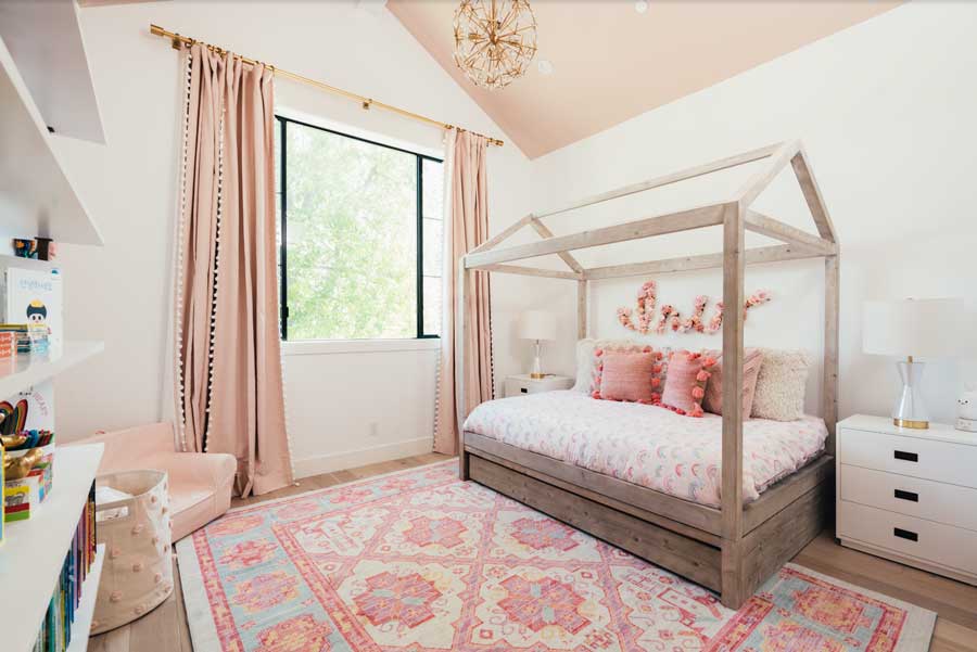 teen girl's bedroom with patterns and prints in pink