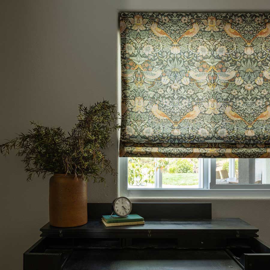 birds and botanicals trending fabric patterns on flat front roman shade in Naples FL home