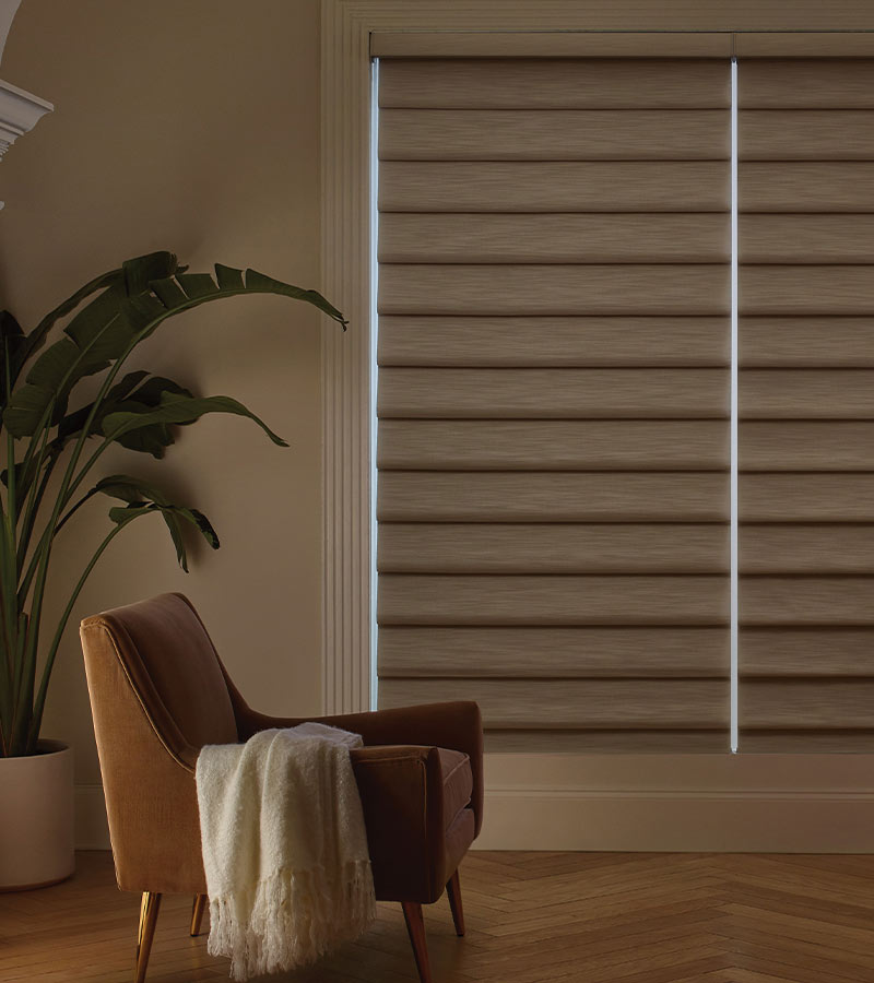 brown window shades shut for room darkening shades in living room with brown chair at home blinds and decor