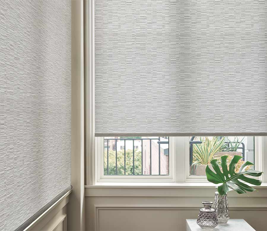 designer roller shades in corner window