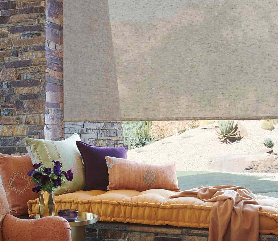 designer roller shades with window seat in living room