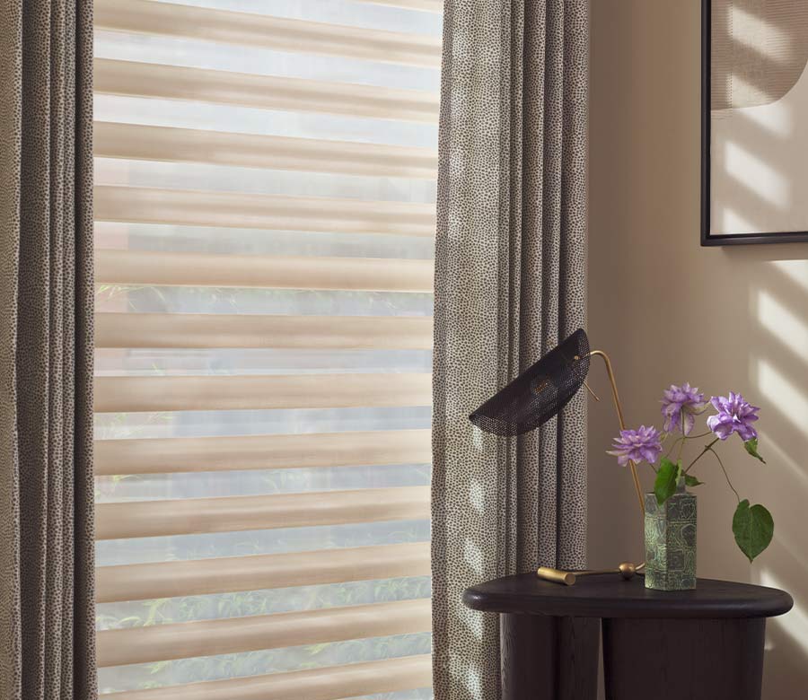 pirouette-window-treatments-layered-drapery-panels-side-by-side-hunter-douglas-at-home-blinds-and-decor adjustable fabric vanes on Pirouette shades controlling glare