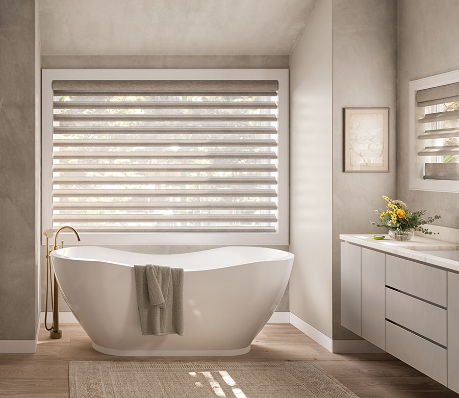 pirouette-window-treatments-primary-bathroom-suite-hunter-douglas-at-home-blinds-and-decor bathroom with tub and pirouette window treatments