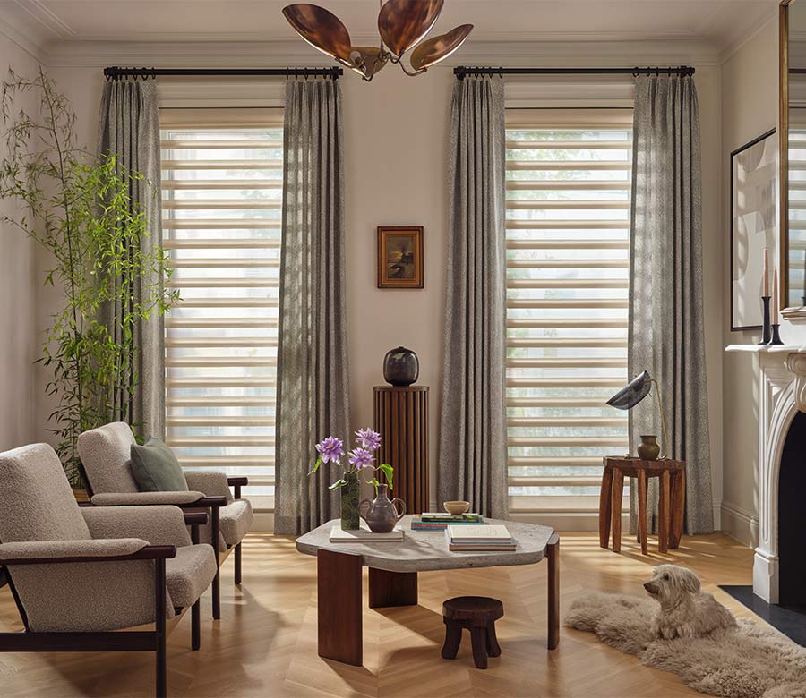 pirouette-window-treatments-sheer-curtains-layered-look-living-room-hunter-douglas-at-home-blinds-and-decor Pirouette window shades with curtains in living room during daylight