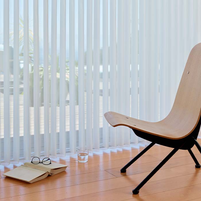 luminette-vertical-window-coverings-hunter-douglas-at-home-blinds sheer vertical shades covering patio doors in living room