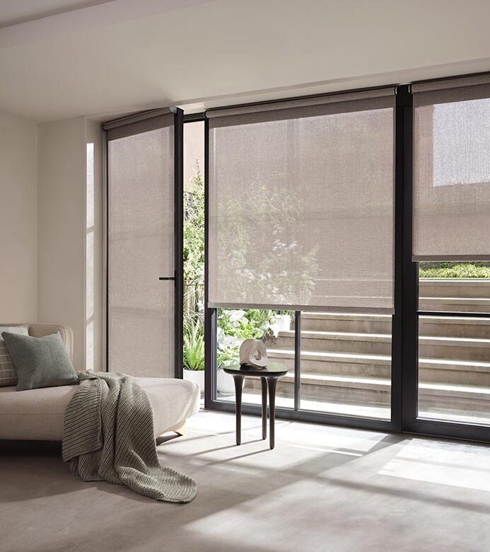 sheer designer shades on glass doors leading to outside
